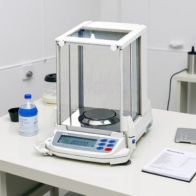 A&D Weighing GR-200 & 300 Compact Analytical Balance Sitting on Laboratory Bench  Front Left Angled View