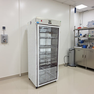 Nuline FW650 Fluid Warmer with Glass Door Closed Standing Against Laboratory Wall Angled Right Front View