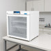 Nuline EC110 Pharmacy Refrigerator with Glass Door Closed Sitting on Laboratory Bench Angled Left Front View