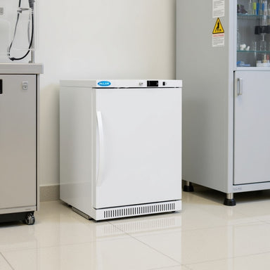 Nuline MLS125P Static Refrigerator with Solid Door Closed Standing Against Laboratory Wall Angled Right Front View