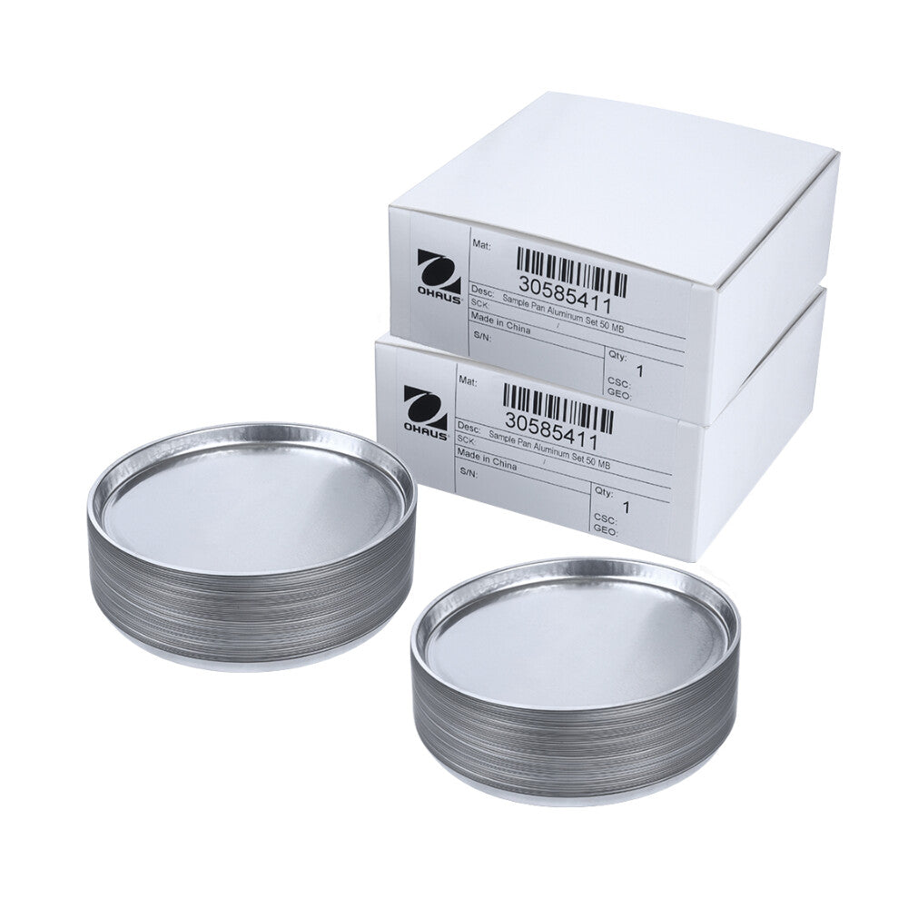 Ohaus MB Series Aluminium Sample Pans 50 Pk x 2 Sitting on Surface with Pans Stacked Out of Box Angled Left 