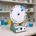 Ratek RSM7DC Rotary Mixer with Universal Carrier sitting on Laboratory Bench Front Angled Right View